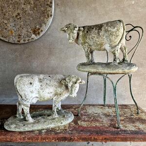 Real pair of cast stone cows
